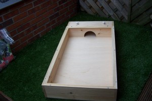Wooden tortoise habitat with sleeping area