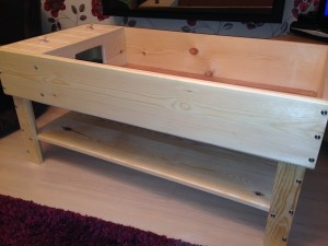 Tortoise table with integrated wooden stand
